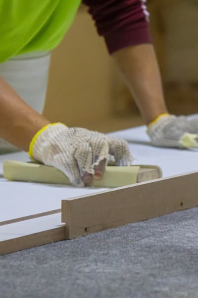 Detail finishing and hand sanding architectural elements